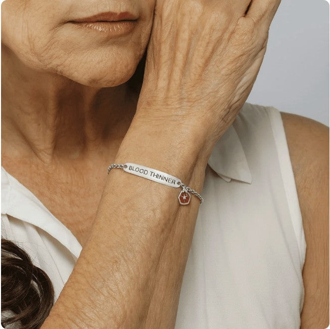 Woman wearing a blood thinner medical alert bracelet
